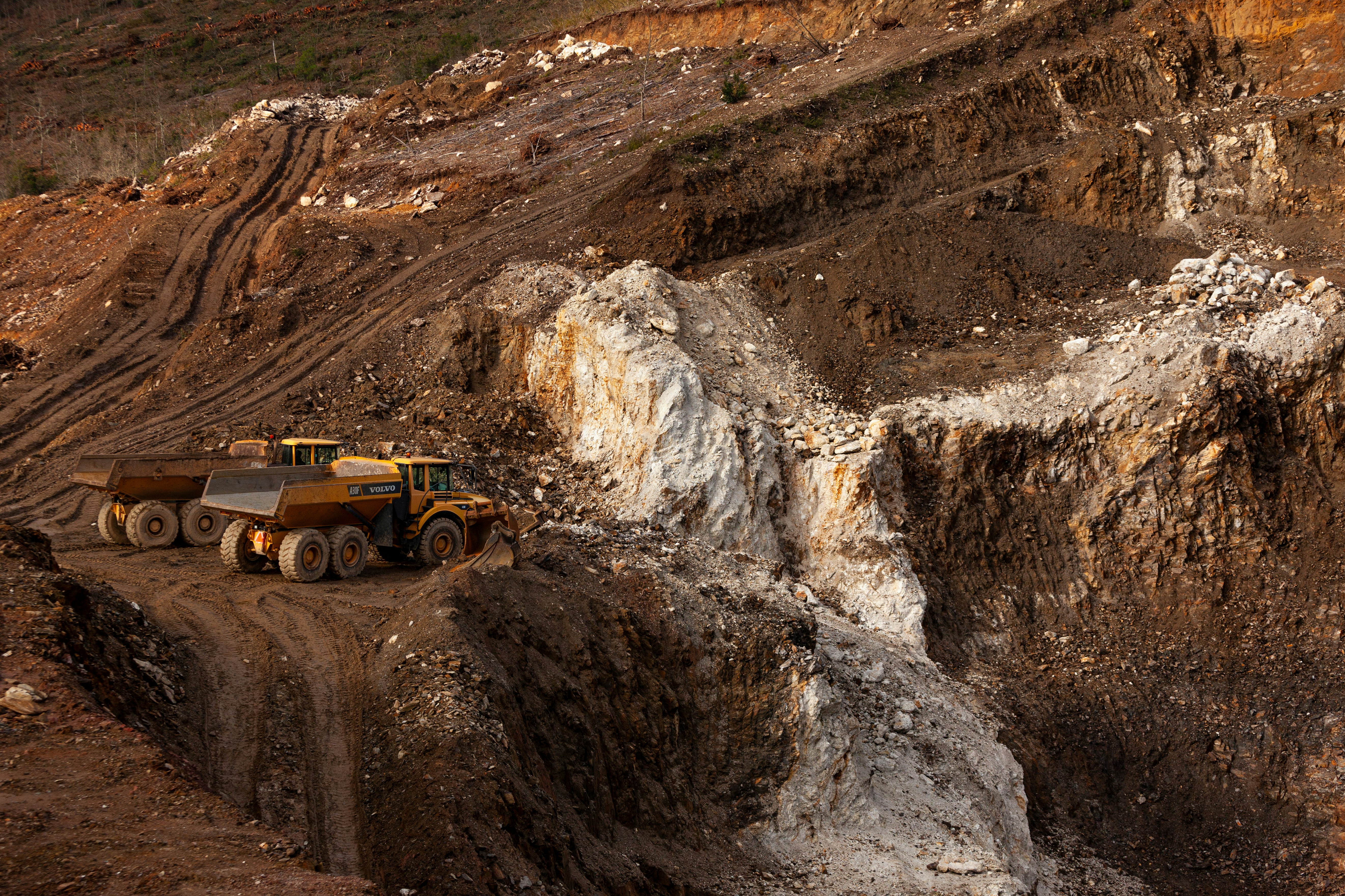 Open-pit mining site with haul trucks